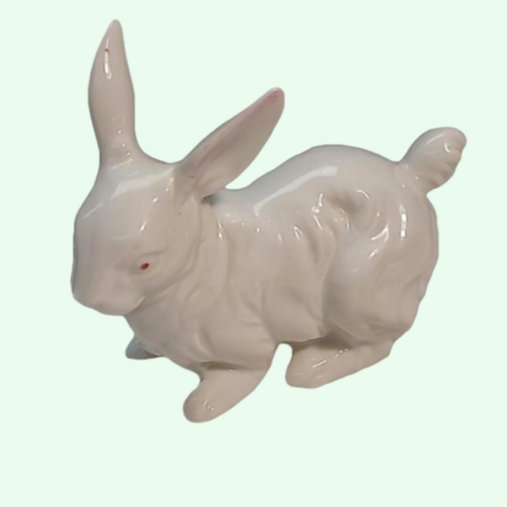 Vintage white bunny rabbit with pink eyes and pink ears.